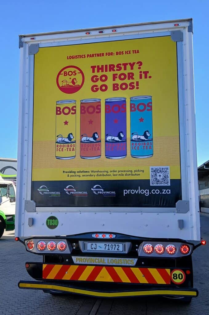 Provincial Logistics truck promoting BOS Ice Tea with vibrant branding and slogan.